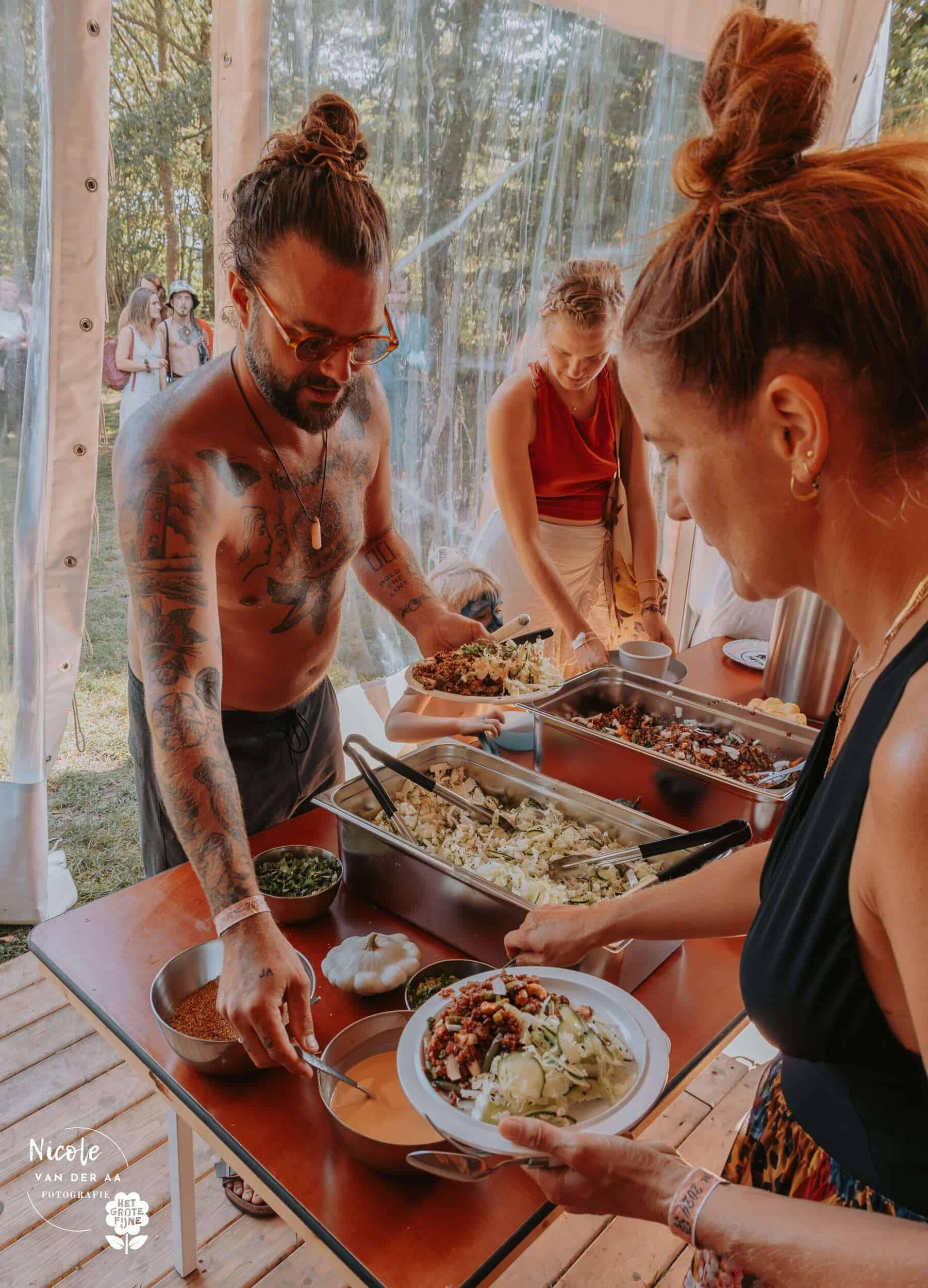 Fresh food being served at a shared table
