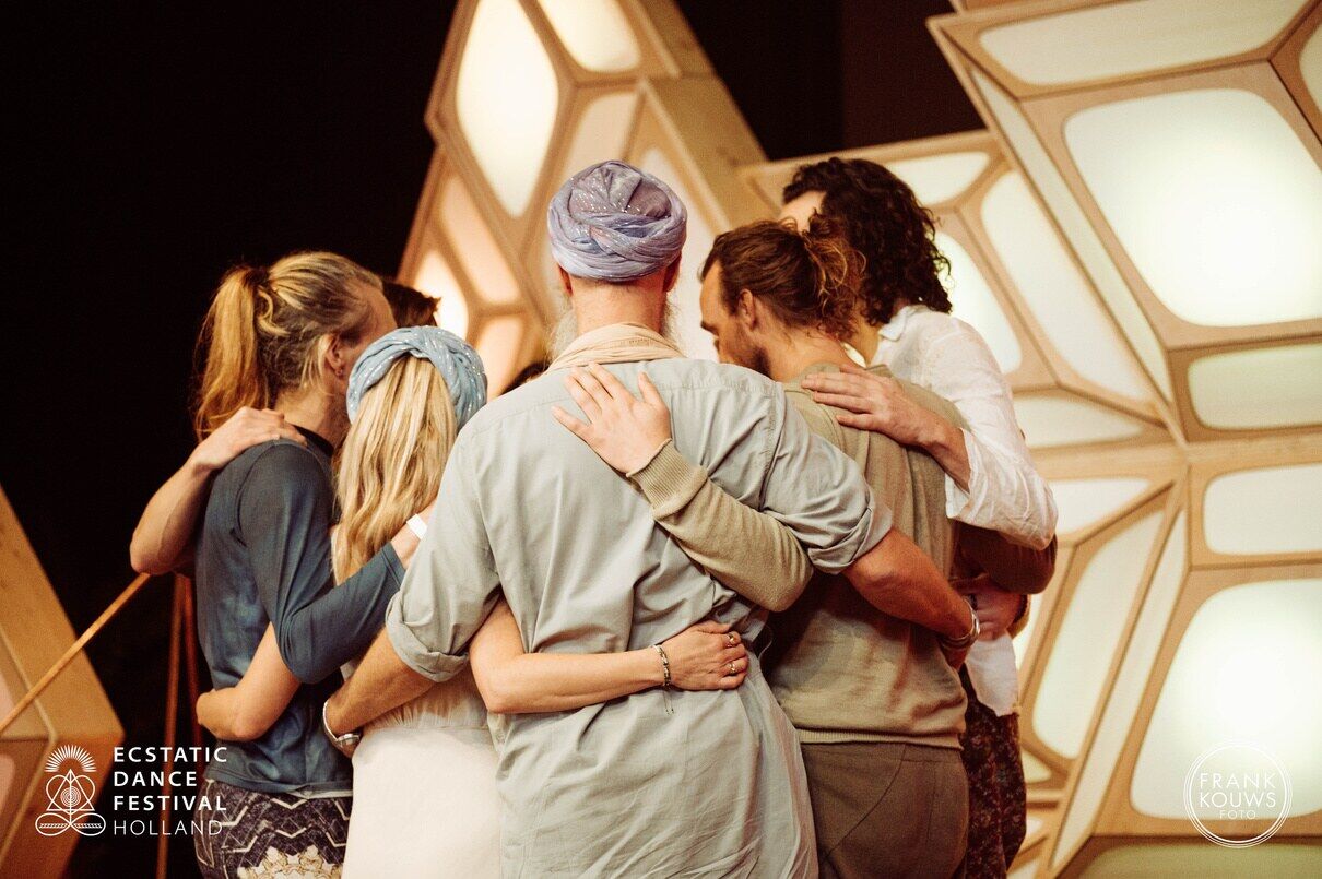 A group embracing after a shared experience