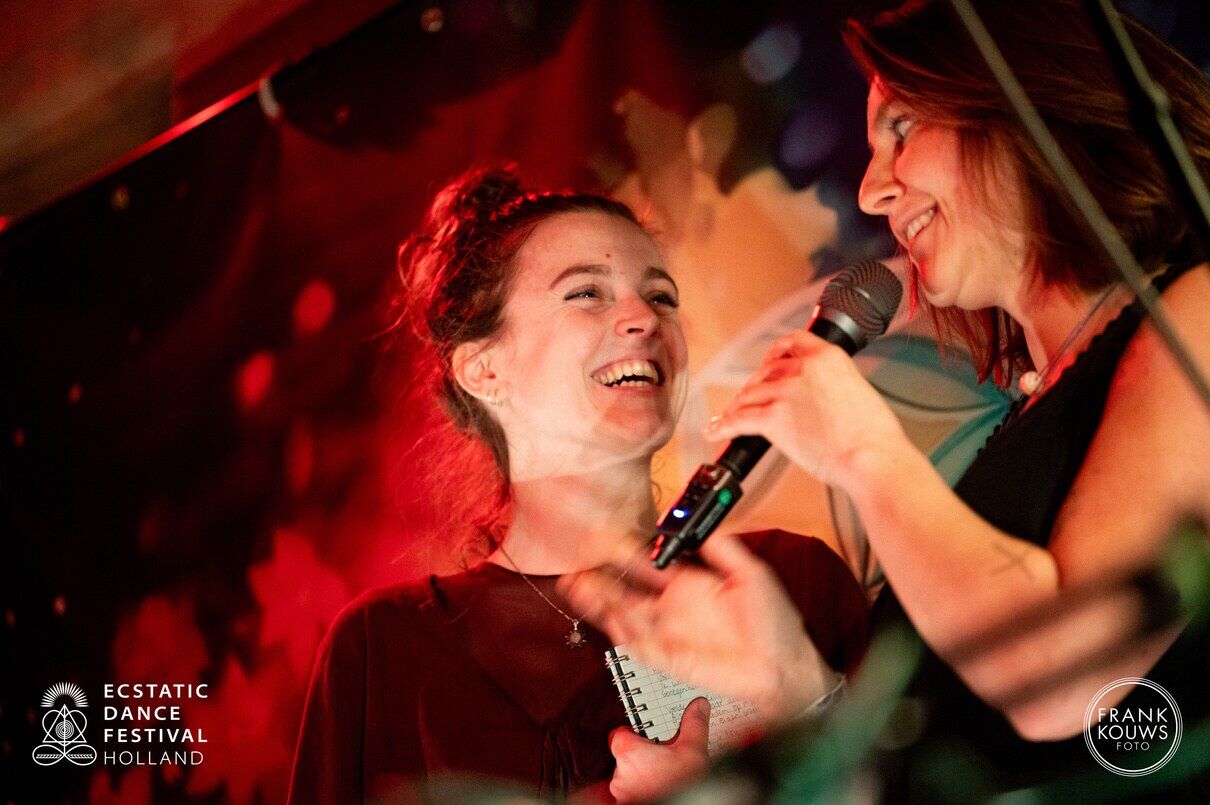 Two singers sharing an intimate live moment
