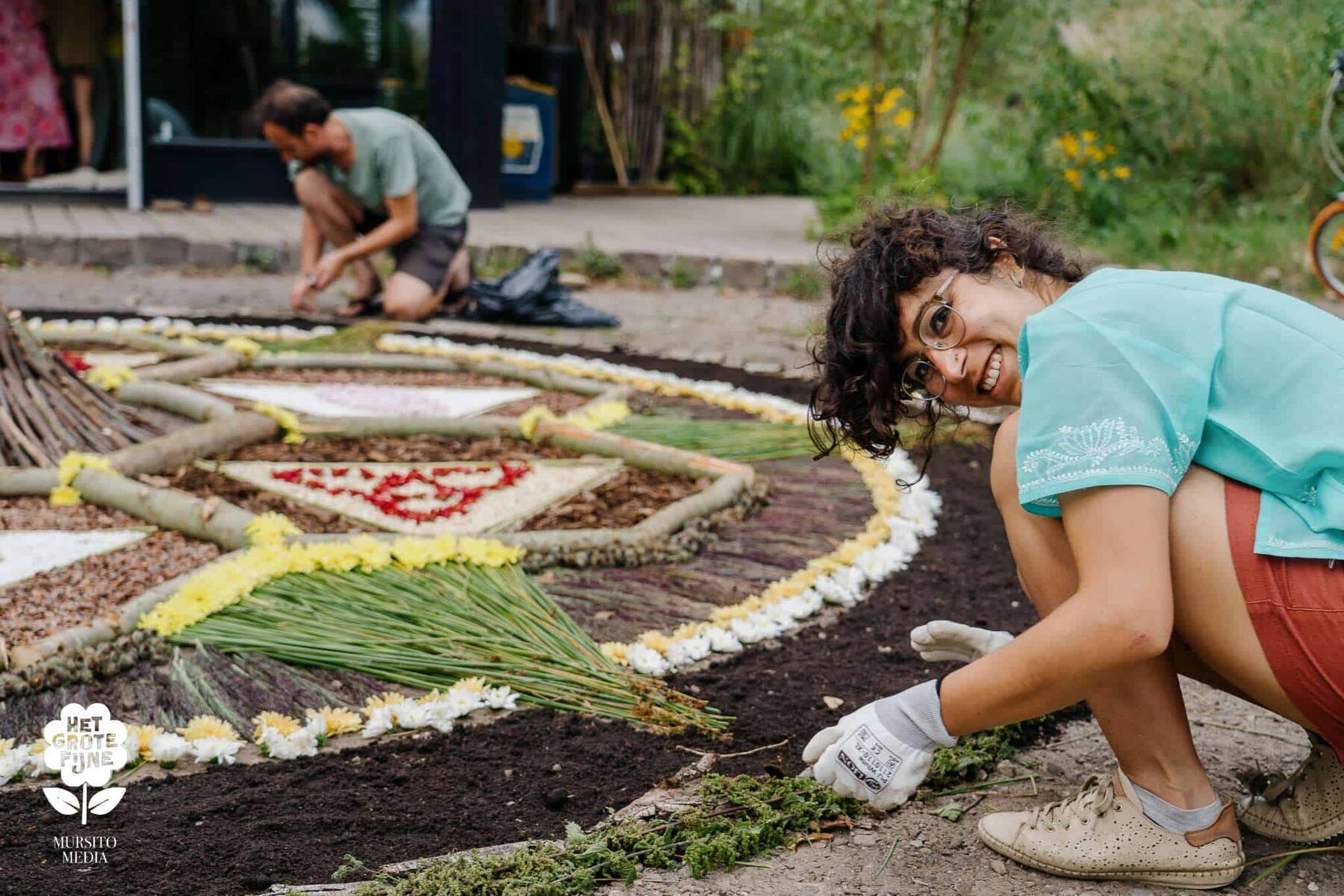 People creating something together, hands in the work